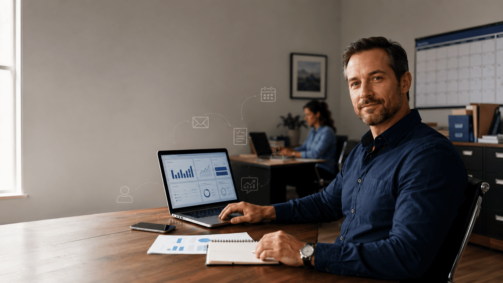 Small-business owner using an automated business workflow system in a modern office